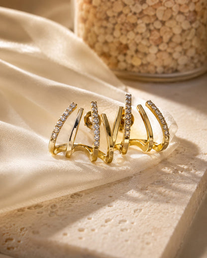 Gold plated studded claw earring