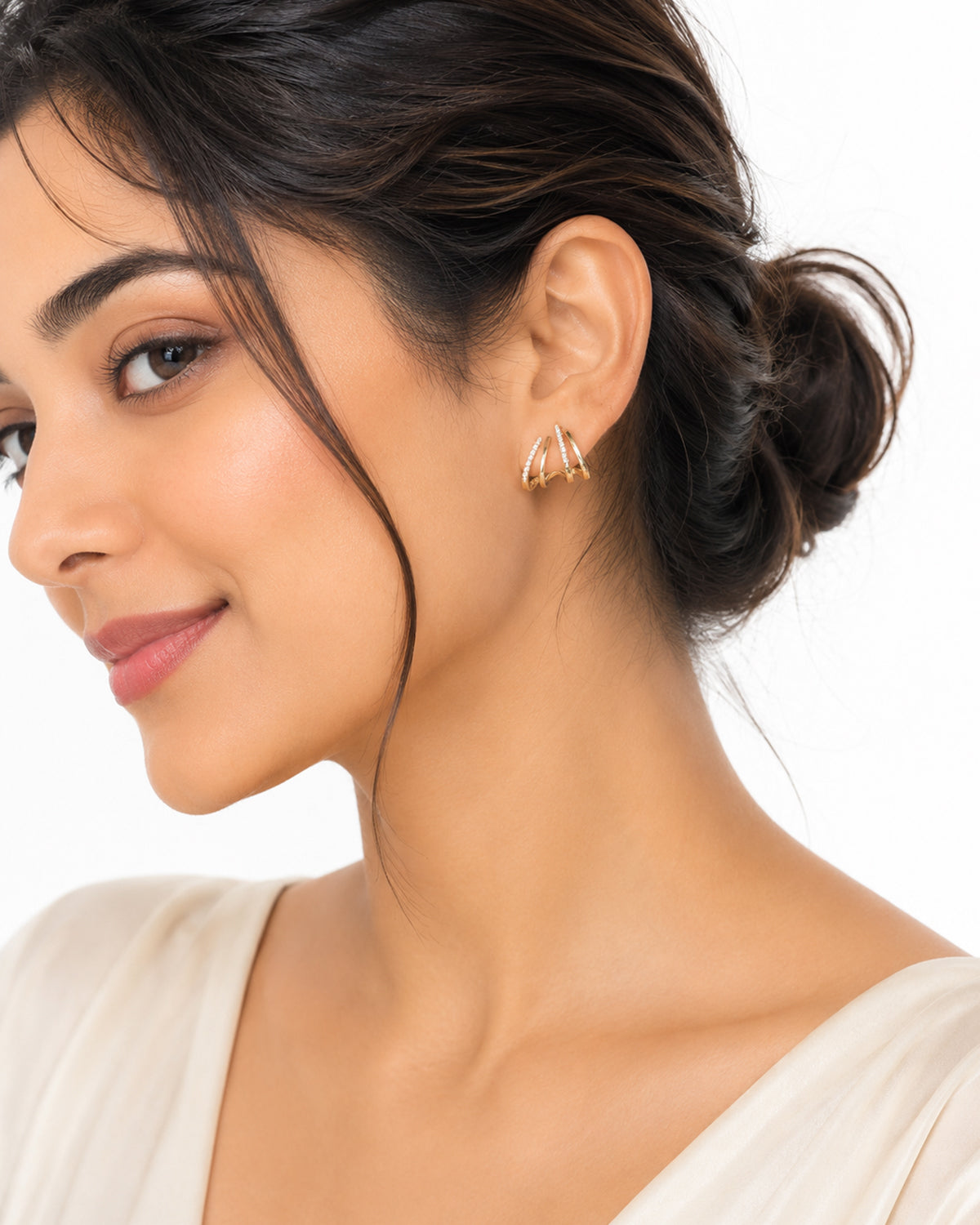 Gold plated studded claw earring